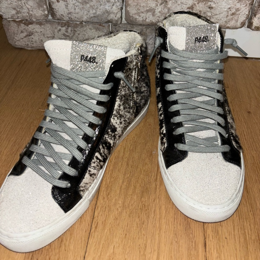 Cow print high top sneakers